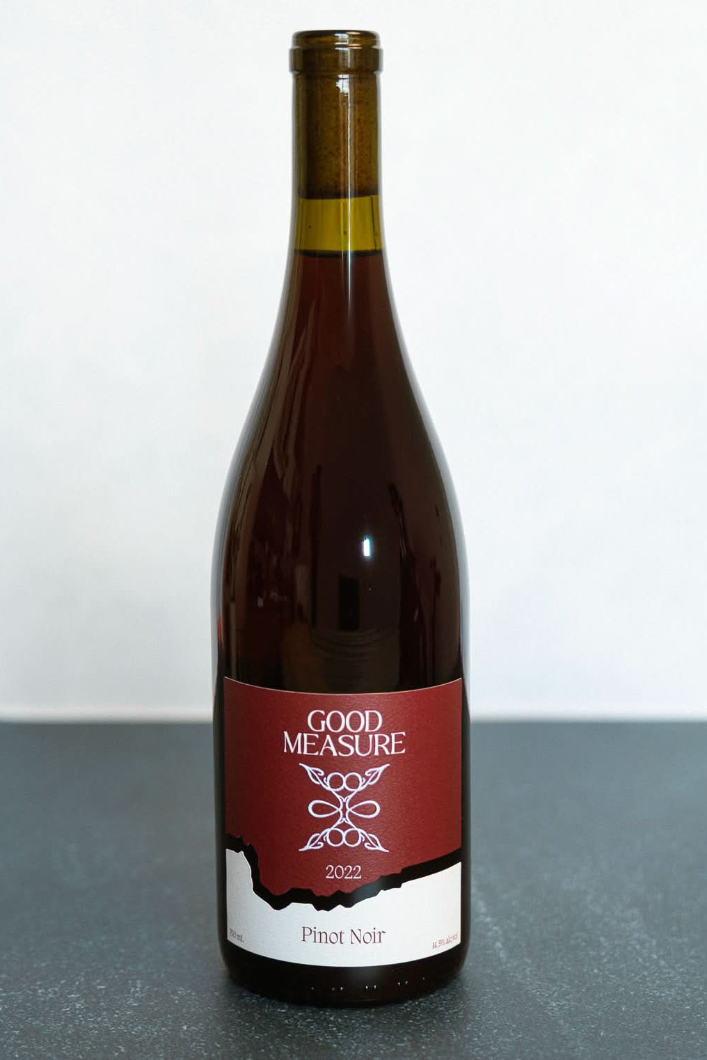 Bottle of Good Measure 2022 Oregon Pinot Noir with burgundy label