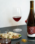 Bottle of Good Measure 2022 Oregon Pinot Noir with burgundy label and glass