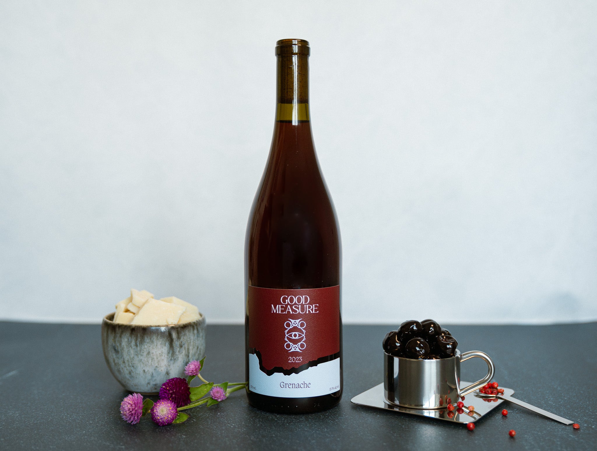 Bottle of Good Measure 2023 Oregon Grenache with burgundy and blue label