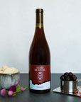 Bottle of Good Measure 2023 Oregon Grenache with burgundy and blue label